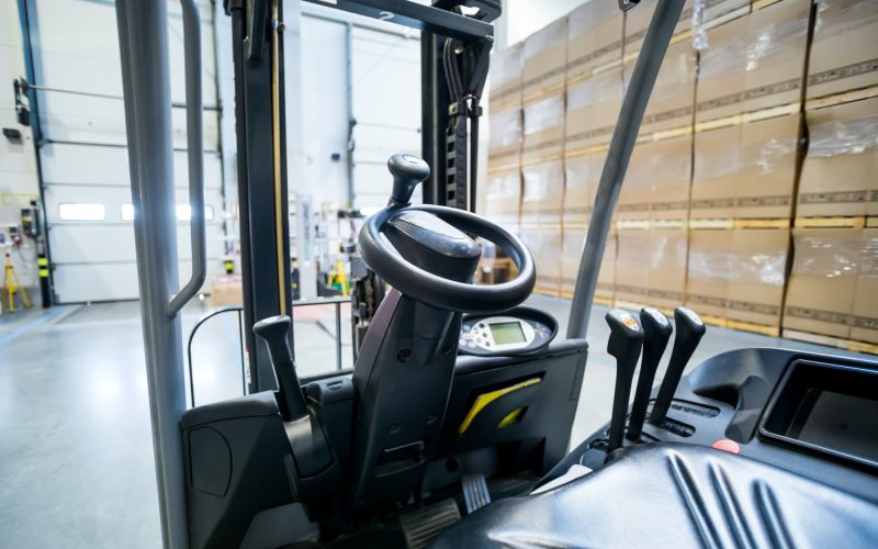 Forklift steering wheel in warehouse